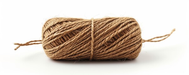 Twine rope roll on white background, close-up detail. Craft and DIY materials concept