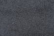 © ArieStudio - New asphalt texture. A frame filled with the textured surface of dry asphalt, showcasing the detailed pattern