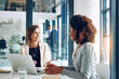 © peopleimages.com - Business people, laptop and women in office for training planning and project idea, research or collaboration. Coaching, support and girl with manager for learning, discussion and problem solving