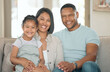 © peopleimages.com - Family, happy and portrait for love, relax and trust in home living room with mother, father and child. Parents, kid and smile as household for care, bond or support together in house lounge on sofa