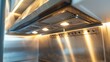 © PaulShlykov - Stainless Steel shiny exhaust hood with grease baffles and fire suppression system