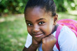 © peopleimages.com - Black girl, portrait and confident at school in outdoor, scholarship and backpack for education. Female person, student study and ready for learning or knowledge, information and child development