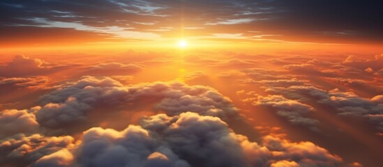 aerial view of beautiful sunset above the clouds with dramatic light