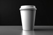 © Rayan Heaven - Mockup of take away paper coffee cup white with space for test black background. Product shot of a blank coffee cup, disposable coffee cup on a desk, beverage branding. Marketing mockup