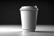 © Rayan Heaven - Mockup of take away paper coffee cup white with space for test black background. Product shot of a blank coffee cup, disposable coffee cup on a desk, beverage branding. Marketing mockup