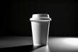 © Rayan Heaven - Mockup of take away paper coffee cup white with space for test black background. Product shot of a blank coffee cup, disposable coffee cup on a desk, beverage branding. Marketing mockup