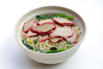 Chinese egg noodles with red pork in hot soup