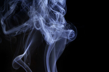 Wall Mural - close up of incense smoke abstract on black background
