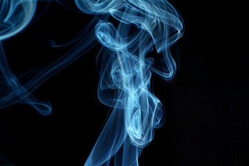 Wall Mural - close up of incense smoke abstract on black background