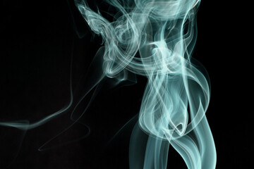 Wall Mural - close up of incense smoke abstract on black background