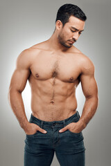 Canvas Print - Man, body and thinking in studio with muscles or abs, shirtless and grey background with model or bodybuilder. Jeans, strong chest and Asian male person on backdrop, confidence with six pack