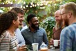 © Asier - Group of diverse friends having a coffee together at a rooftop terrace