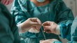 © Ratchadaporn - Healthcare Worker Carefully Tying Suture Knot to Secure Patient s Wound