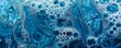 © cac_tus - Abstract blue liquid with bubbles and swirls, close-up view. Fluid art and texture concept