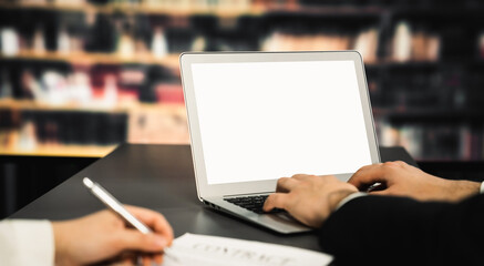 Poster - Empty laptop computer screen for savvy design mockup on a table in library of university