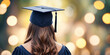 © Wee Ha - Back portrait of graduation woman with graduation cap bokeh background