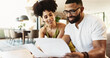© peopleimages.com - Couple, paperwork and couch in home with investment, budgeting and financial notes for saving. Smile, insurance and payment report with happy people together with documents for finance planning