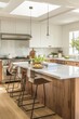© banthita166 - Stylish Contemporary Kitchen with Modern Appliances, Island, and Cookbooks in Bright Natural Light