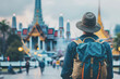 © ZAY WIN HTAI - Back view of a traveler man with backpack at Thailand pagoda