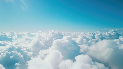 Wall Mural - Beautiful aerial view of nature with white clouds and blue sky captured from a drone on a sunny day from high altitude in the front perspective