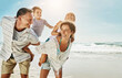 © ReadyAtTheEase/peopleimages.com - Love, happy family and piggyback at a beach for summer fun, care and bonding on vacation in nature. Freedom, support and kids with parents at sea for travel, playing and back ride games in Florida