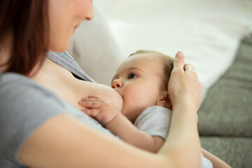 3 months old baby boy being brest fed