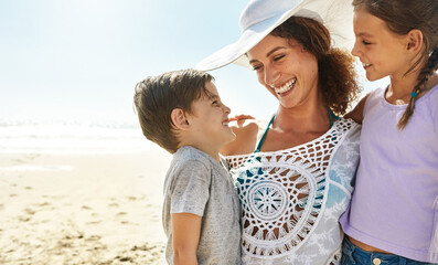 Wall Mural - Beach, family and mother smile for holiday, fun and together with children for Australia adventure. Summer, ocean and vacation afternoon with happy woman, siblings and kids laughing in nature