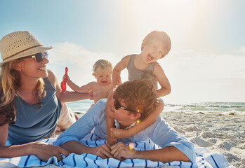 Poster - Woman, man and kids on beach as family on holiday, vacation in Istanbul for happiness or memory. Excited, people and ocean for relax, together and bonding as parents for growth, development and love