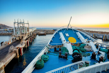 Wall Mural - Malta to Gozo, Passengers board modern ferry at Cirkewwa Passenger terminal for scenic cruise to idyllic Gozo Island. Malta travel destination.