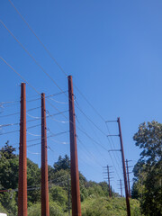 Wall Mural - Rusty electrical pylons and high-voltage power lines.