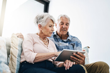 Poster - Tablet, browsing and mature couple in living room in house for online movie streaming on website. Subscription, tech savvy and people in home with networking, social media and app in retirement.