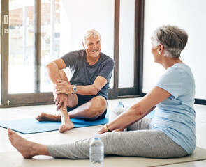 Canvas Print - Fitness, senior couple and talking on yoga mats together for rest, recovery and break from workout at home. Mature, man and woman with smile, water bottle and conversation for exercise and wellness