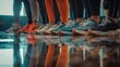 © Tamara - Colorful athletic shoes in a row with reflections on shiny floor. Ideal for fitness, casual wear, team sports concepts
