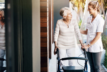 Canvas Print - Women, nurse and senior patient with walker for help, support and happy with care at home. People, smile and person with a disability with caregiver for healthcare, rehabilitation and exercise