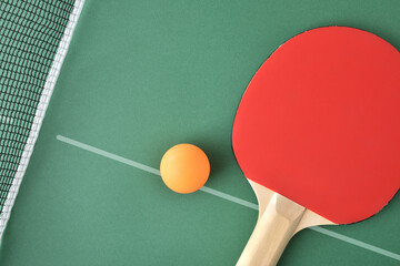 Wall Mural - Ping pong paddle and ball on green game table top