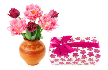 Wall Mural - A gift in festive packaging and tulips in a vase isolated on white. Collage. Free space for text.