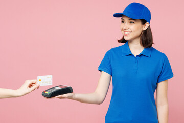 Sticker - Delivery girl employee woman wear blue cap t-shirt uniform workwear work as dealer courier hold bank payment terminal to process acquire credit card isolated on plain pink background. Service concept