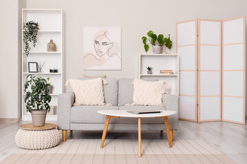 Wall Mural - Light living room with folding screen, comfortable sofa, coffee table and shelving unit