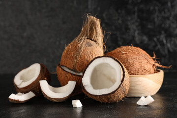 Fresh coconuts on black background
