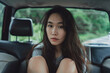 © mizmizstk - a woman sitting in the back seat of a car