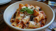 © Immersive Dimension - Traditional Italian Pasta all Norma Dish, Pasta With A Tomato Sauce Featuring Fried Eggplant, Basil, And Grated Ricotta Salata Cheese