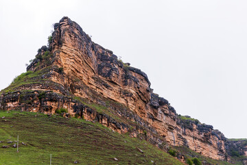 Wall Mural - Mountain peak placed near Honey Waterfalls is under cloudy sky