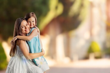 Wall Mural - Young Mother and daughter play in forest