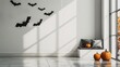 © Jafree - Minimalist Halloween decor with pumpkins and bats in a bright white room. Concept of modern festive decor, autumn, indoor decoration, simplicity. Mockup