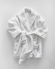 Wall Mural - White soft bathrobe top view isolated on a white background