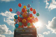 © Ivan - Close-up box releasing many colorful balloons into the sky with space for text or inscriptions