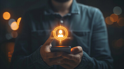 Aufkleber - Close-up of a man's hands holding a phone with a glowing contact icon, symbolizing connectivity