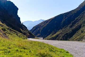 Wall Mural - Scenic view of mountain pass road named Tremola at Swiss mountain pass Gotthard on a sunny late summer day. Photo taken September 10th, 2023, Gotthard, Canton Ticino, Switzerland.