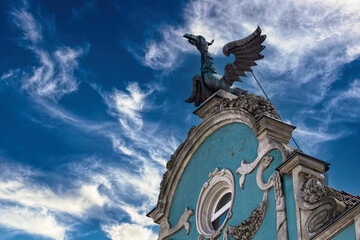 Wall Mural - Bronze medieval dragon figurine on the roof. Ancient architecture of Gdansk