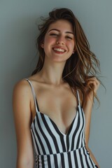 Poster - A woman wearing a black and white striped dress